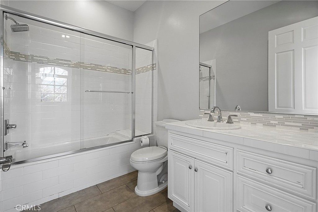 Guest bath with marble vanity at 22510 La Quilla Dr, Chatsworth