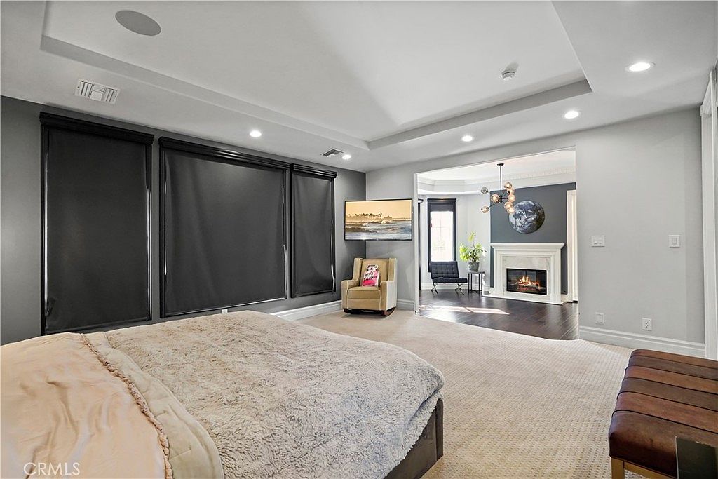 Primary suite with fireplace and sitting area at 22510 La Quilla Dr, Chatsworth