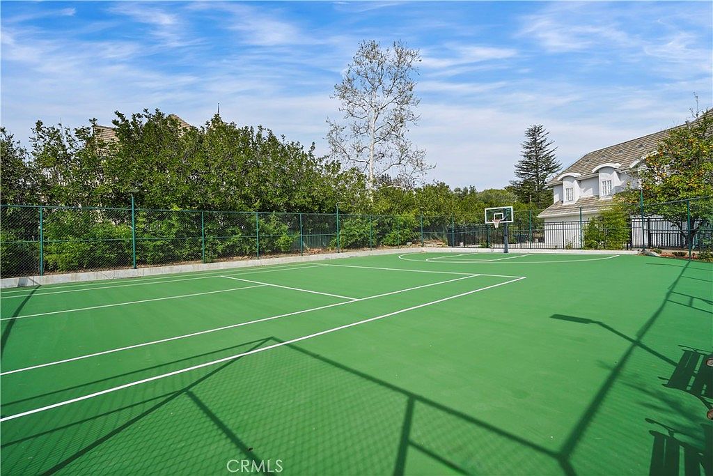 Full-size tennis and basketball court at 22510 La Quilla Dr, Chatsworth
