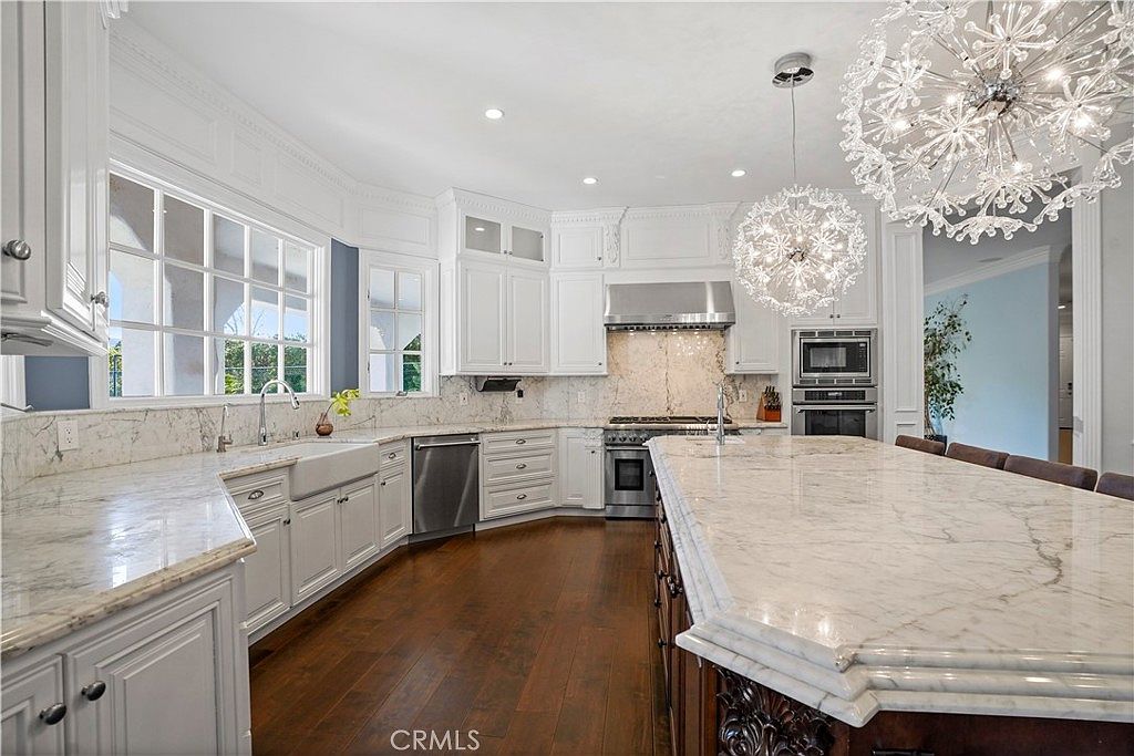 Marble prep counters and professional appliances at 22510 La Quilla Dr, Chatsworth