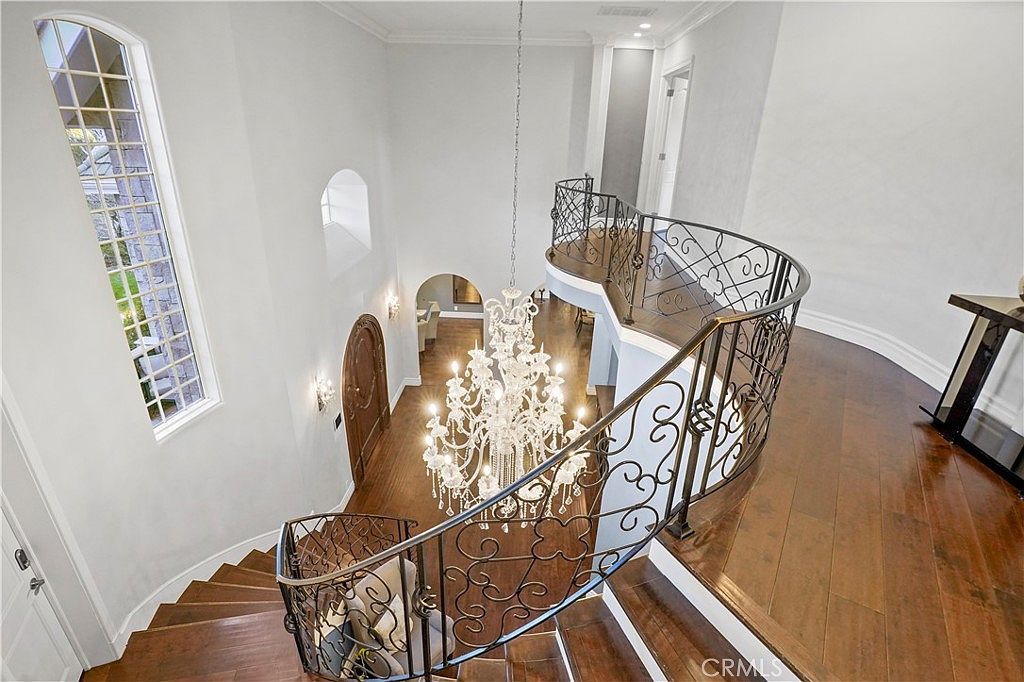 Wrought-iron balustrade over the entry at 22510 La Quilla Dr, Chatsworth