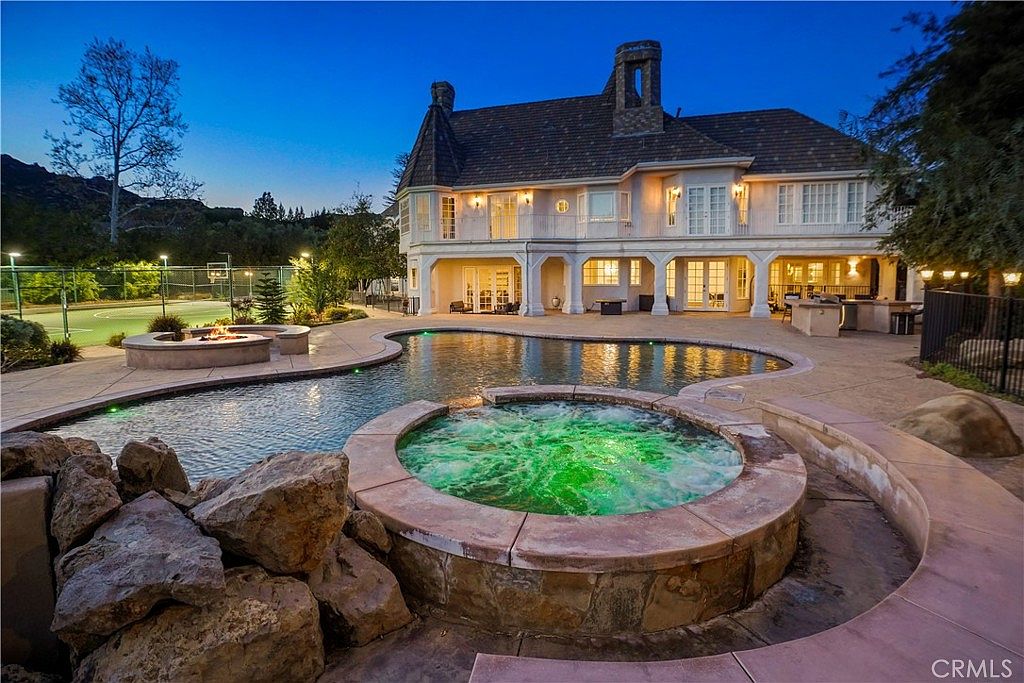 Spa and waterfall detail at nightfall at 22510 La Quilla Dr, Chatsworth