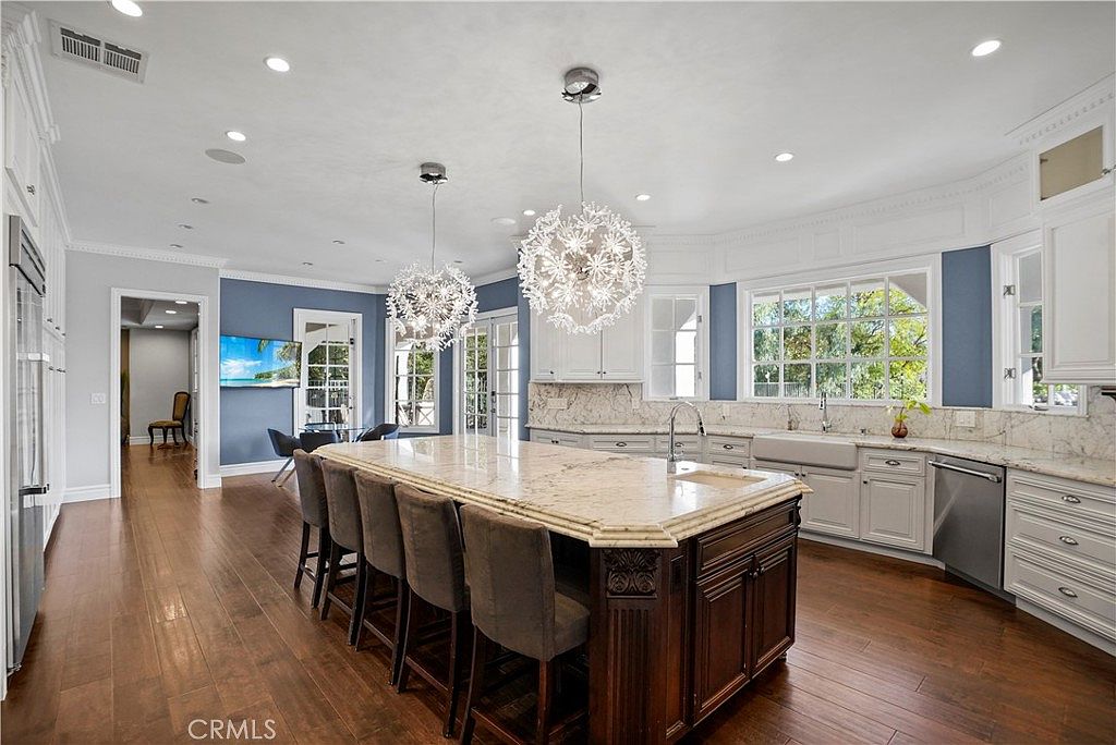 Kitchen seating island and breakfast area at 22510 La Quilla Dr, Chatsworth